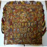 A 19th Century Uzbek saddle cover, the boteh design woven in coloured silks on a brown camel hair