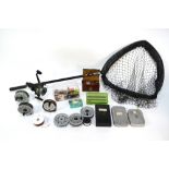 A quantity of fly fishing reels, lures, spinners and a landing net etc (box)