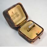 A five stone old cut diamond ring having rose points between, in yellow gold carved claw setting,