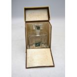 An Art Deco glass perfume bottle with square green flash glass panel to both the bottle and