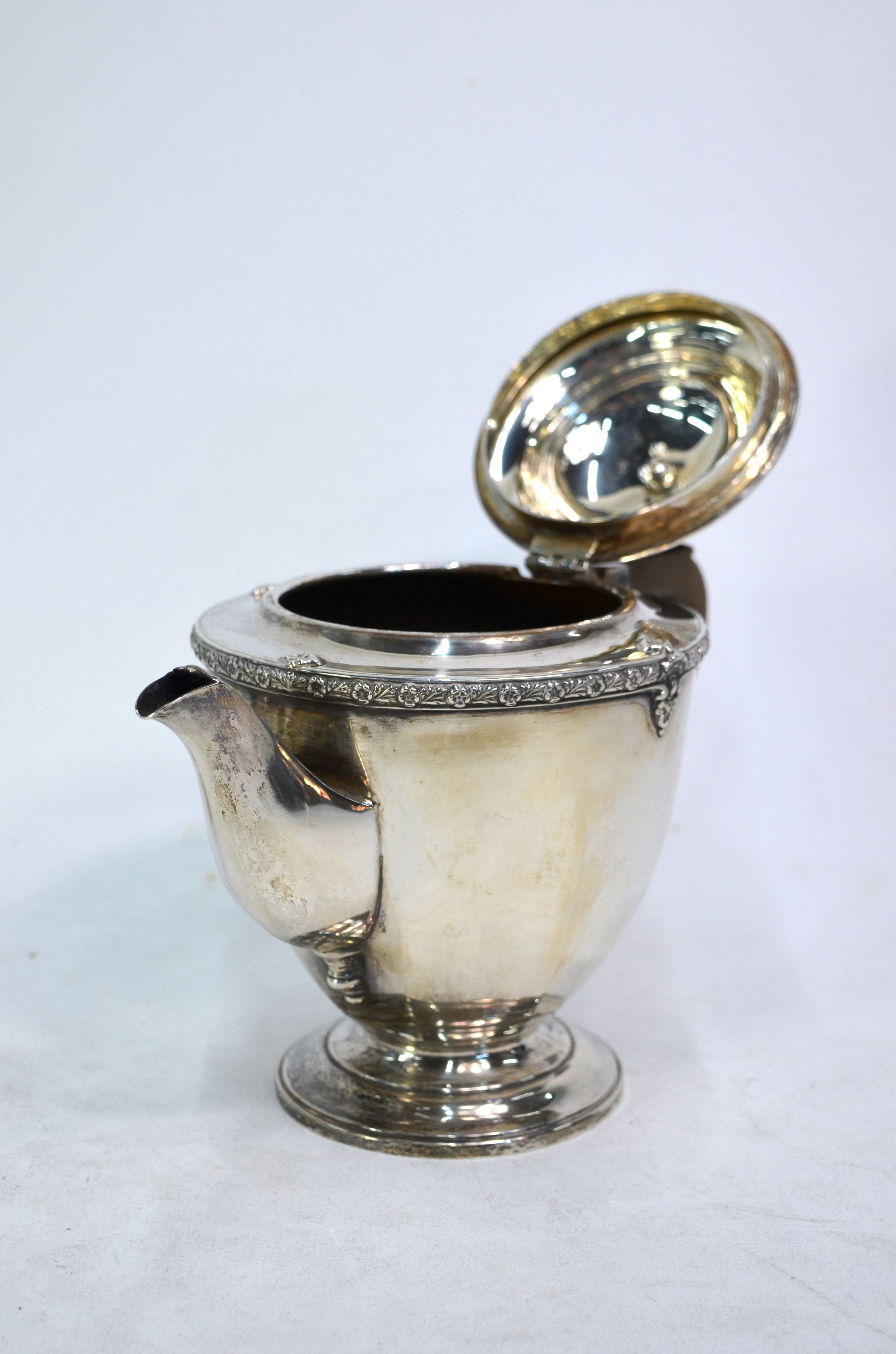 A three-piece silver tea service with floral-cast rim and moulded foot, composite handle and finial, - Image 4 of 5