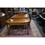 A 19th century mahogany D-end dining table, the two gateleg ends united by two insert leaves, raised