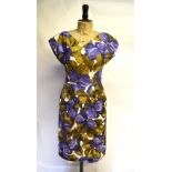 A 1950s satinized cotton day dress in bold floral print, purple/brown on white ground, by Sambo