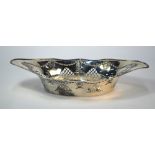 An Edwardian Sheraton revival silver bread basket with flared rope-twist rim and embossed and