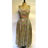 1950s oyster Chinese silk brocade cocktail dress with garden, temple and lake pattern in green/