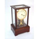 A late 19th/20th century electro-magnetic clock by the Eureka Clock Co Ltd, in glazed mahogany case,