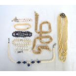 A five-row ribbon style simulated pearl necklace having graduated ends, 88 cm long to/w a five-row