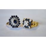A sapphire and diamond set circular cluster ring, yellow and white metal set to/w a sapphire and