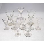 A collection of ten drinking glasses: An 18th century cordial glass, round funnel bowl with half