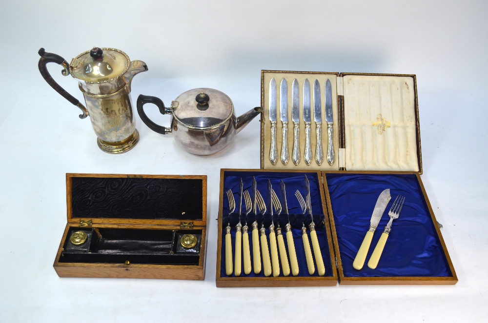 A cased set of fruit knives with loaded silver handles and electroplated blades, Sheffield 1910,