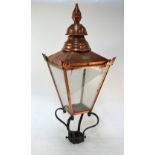 An antique cast iron street lamp post with large four panel copper lantern with ovoid maker plate 'D