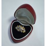 An 18ct yellow gold diamond set flower style ring