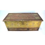 An old brass and stud decorated hardwood Zanzibar chest, the hinged top over three short drawers, 92