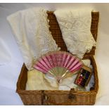 A wicker hamper containing a 19th century Chinese silk, mother-of-pearl and lace-edged fan, to/w