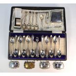 A cased part set of eleven teaspoons with tongs, Sheffield 1912, to/w a cigarette case, Birmingham