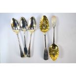 A pair of silver fiddle pattern berry spoons with embossed and gilded bowls and floral-engraved