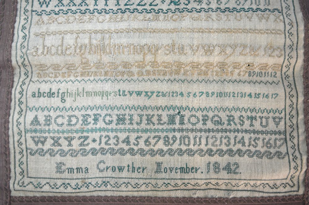 A Victorian alphabet sampler by Emma Crowther, 1842, 31 cm square, unframed and mounted on a green - Image 2 of 4