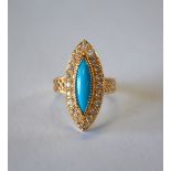 A rose-coloured metal marquise style cluster ring set turquoise and white paste, size Q