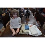 An Alt Beck & Gottschalk bisque-head girl doll, stamped 'AB 1362 6 1/2' with brown wig, sleeping