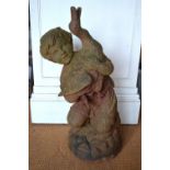 An antique cast iron fountain centre formed of a boy and duck, on circular base, 82 cm high