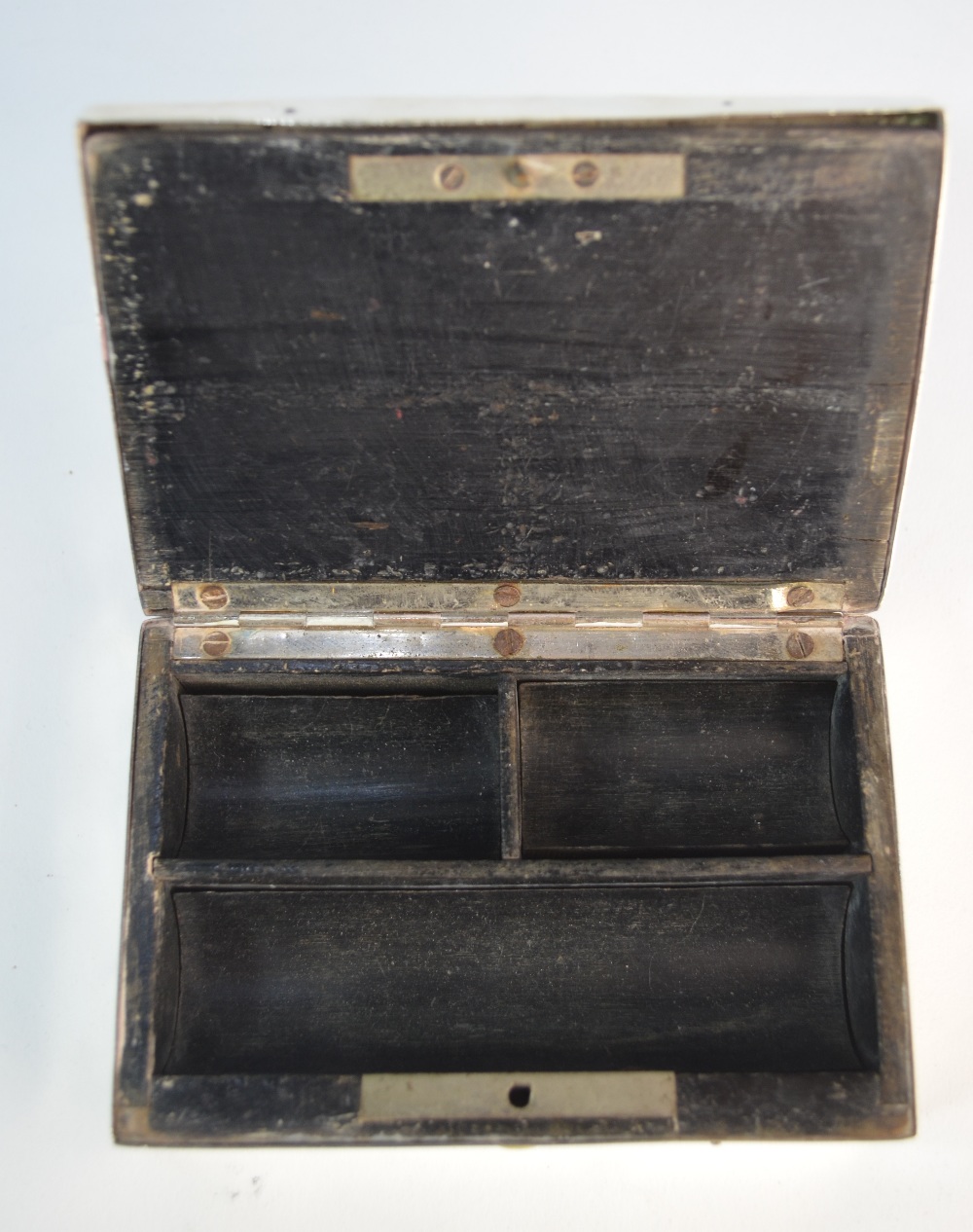 A late Victorian silver stamp-box, embossed with winged cherub heads, ebony lining with curved - Image 5 of 5