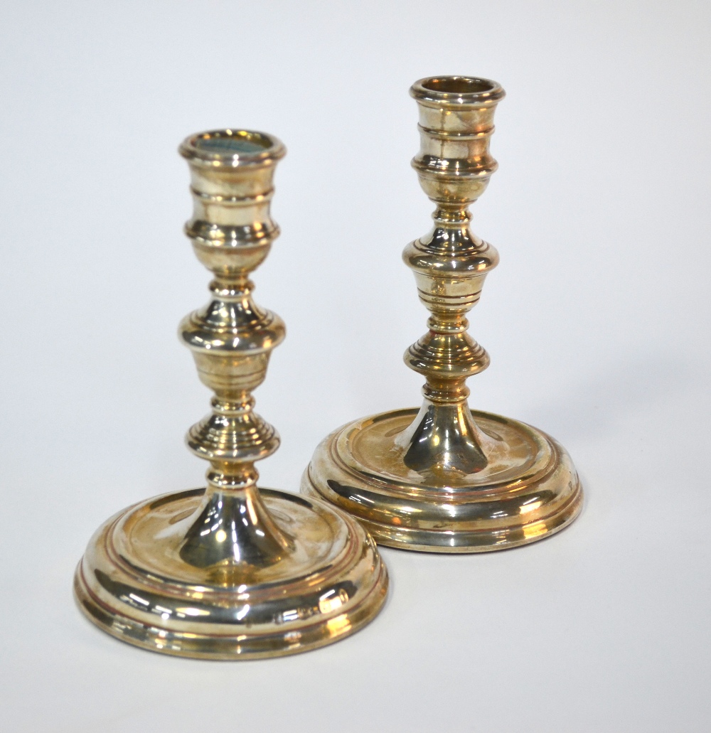 A pair of loaded silver baluster candlesticks in the early 18th century manner, Day-Mar