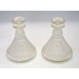 A pair of 19th century stepped cut ship's decanters, two facet cut neck rings, star cut base,