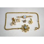 A collection of opal set jewellery including scroll style pendant on chain, bar brooch, flower
