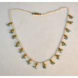 A single row seed pearl choker necklace, having yellow metal, turquoise and small pearl fringe