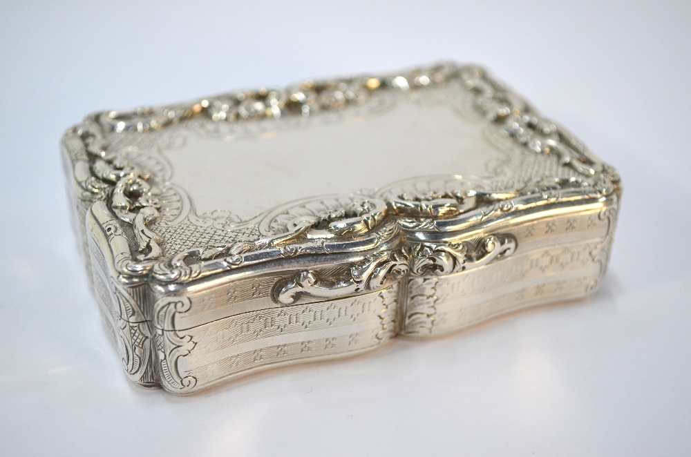 An early Victorian Nathaniel Mills large snuff box of cartouche form with engine turned decoration