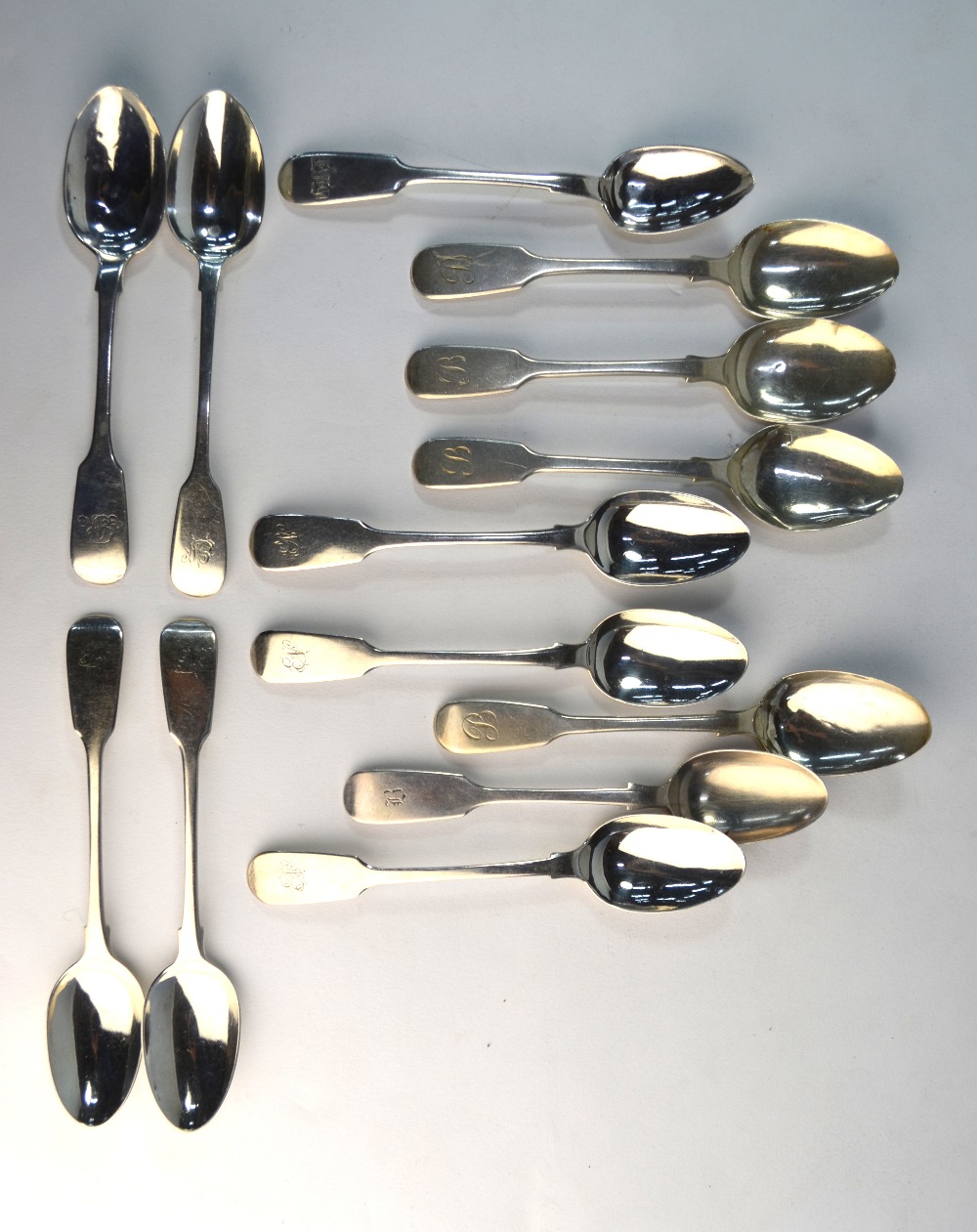 Twelve various Georgian and later fiddle pattern teaspoons including a Russian 84 zol. example, 7.