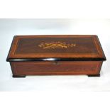 A late 19th century Swiss rosewood, kingwood and ebonised cylinder music box, playing ten airs on