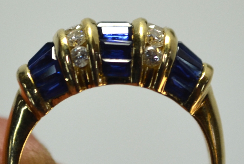 A sapphire and diamond bombe style ring, set baguette sapphires and brilliant cut diamonds, in - Image 6 of 6