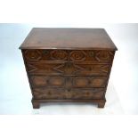 An 18th century and later oak chest of two short over three long graduated drawers, with applied
