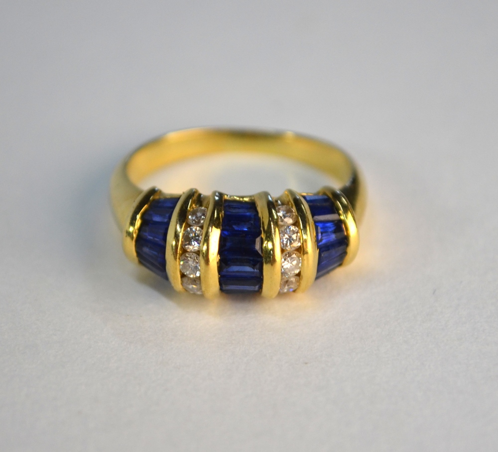 A sapphire and diamond bombe style ring, set baguette sapphires and brilliant cut diamonds, in