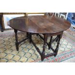 A late 17th century joint oak gateleg table, the ovoid drop leaf top raised on a baluster turned and