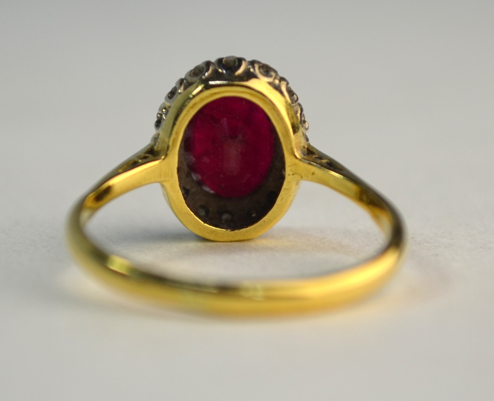 A ruby and diamond oval cluster ring, yellow and white claw setting, size P, not marked - Image 5 of 6