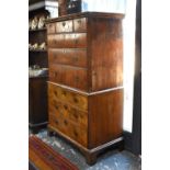 An 18th century cross-banded walnut chest on chest having three short over three long graduated