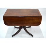 A Victorian cross-banded mahogany table with drop leaf top over a frieze drawer to end, raised on
