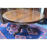 A Victorian rosewood breakfast table, the tilt-top raised on a gadrooned acanthus moulded support to