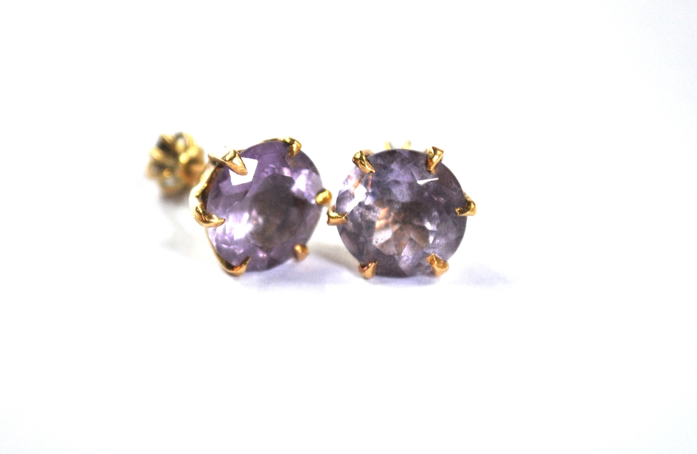 A pair of circular pale amethyst stud earrings, yellow metal claw set - Image 2 of 4