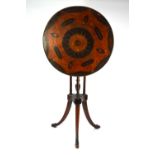 A George III inlaid satinwood tilt top wine table, the circular top centred by a batwing design