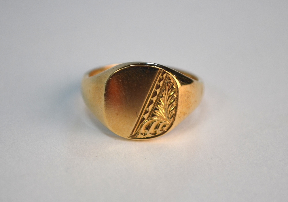 A 9ct yellow gold gentleman's signet ring, half engraved, size P, approx 6.5g