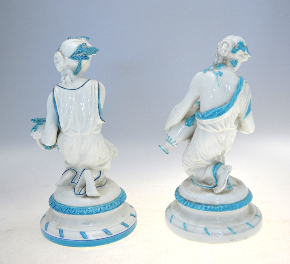 A matched pair of English porcelain classical kneeling figures of maidens, one carrying a sheath - Image 2 of 3