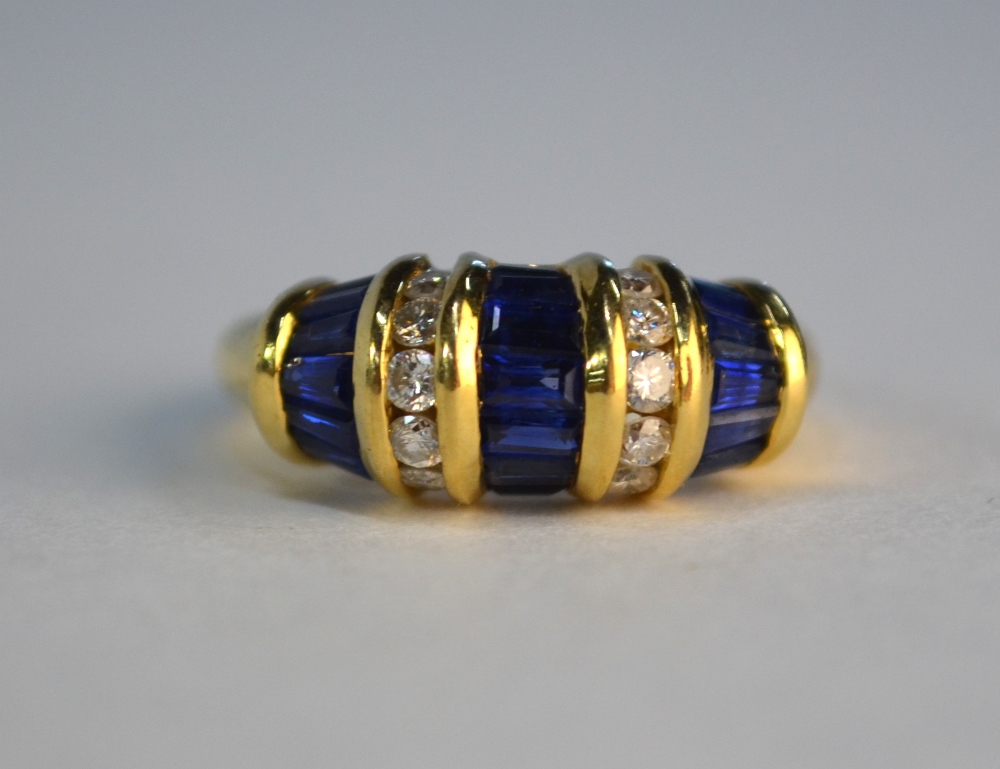 A sapphire and diamond bombe style ring, set baguette sapphires and brilliant cut diamonds, in - Image 2 of 6