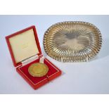 A US Gorham Sterling reeded pin-dish, 13.5 x 10cm, 2.6oz, to/w a silver gilt 'Pro Europa' medal,