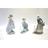 Three Lladro figural groups:  Afternoon Snack, 6577, 1999, 24 cm high;  Goose Girl, 4568, 1988, 23