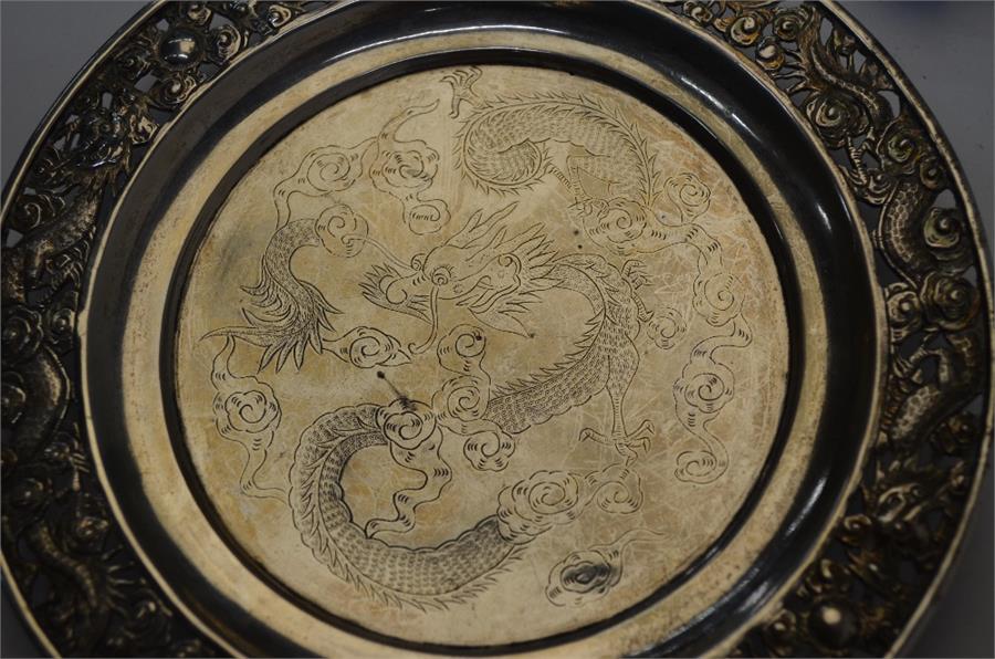 Three pieces of Chinese white metal, comprising: a circular dish, decorated with dragons, 15 cm - Image 4 of 10