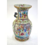 A Chinese Canton famille rose vase decorated in typical colours with narrative scenes and Natural