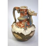 A Satsuma ewer with dragon spout, similar to the preceding lot, decorated with a design of fans